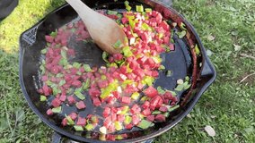 The pleasure of cooking chopped sausage and green peppers in an open-air cast iron pan.	
 - Powered by Shutterstock - Get 15% off with code: PIKWIZARD15