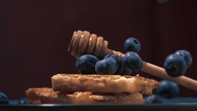 Dropping blueberries onto waffles close up super slow motion shot selective focus - Powered by Shutterstock - Get 15% off with code: PIKWIZARD15