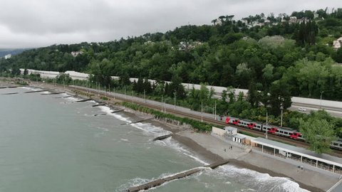 Aerial View of Train Traveling Along Sochi Coast in Spring
