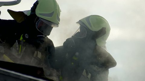 SouthTyrol, ITALY - CIRCA 2012: Fire brigade extinguish fire, garden house burns.