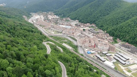 Aerial View of Krasnaya Polyana in Mountain Valley by River