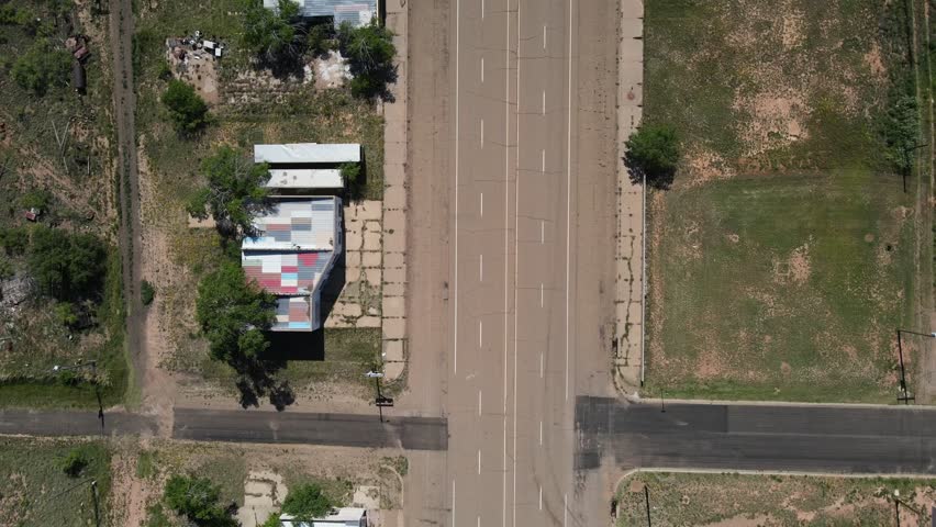Aerial top down of remote desert town road historic route 66 midpoint Adrian Texas TX USA