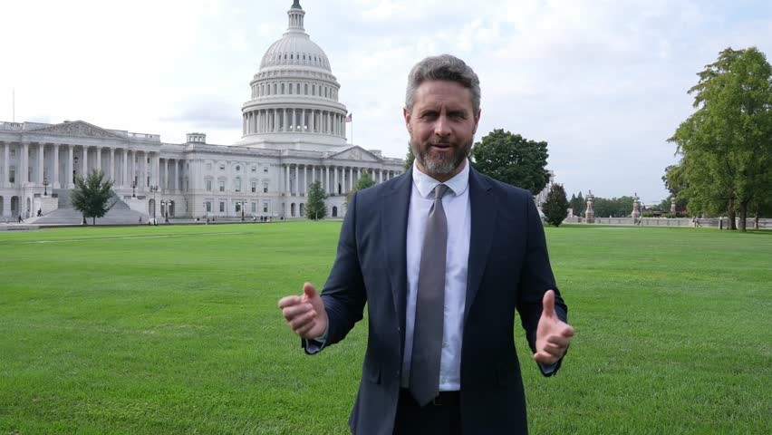 Businessman front of US Capitol. Businessman in Washington DC. Politician speaking at Capitol. Lobbyist man in suit. Politician election campaign. Successful career in USA