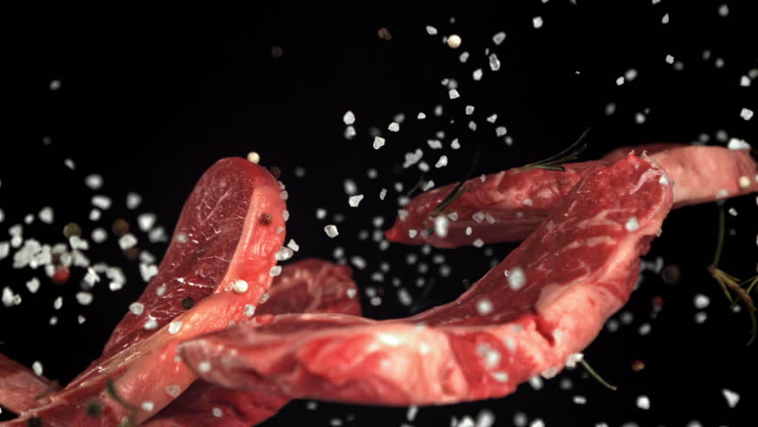 Beef ribeye steak fly up and falls down. Filmed on a high-speed camera at 1000 fps. High quality FullHD footage