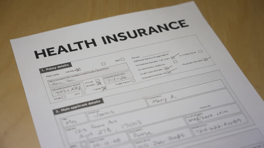 Close-up of a health insurance application form stamped with a large red “REJECTED” mark, symbolizing denial or claim refusal. Fictional data in form. 14939  	