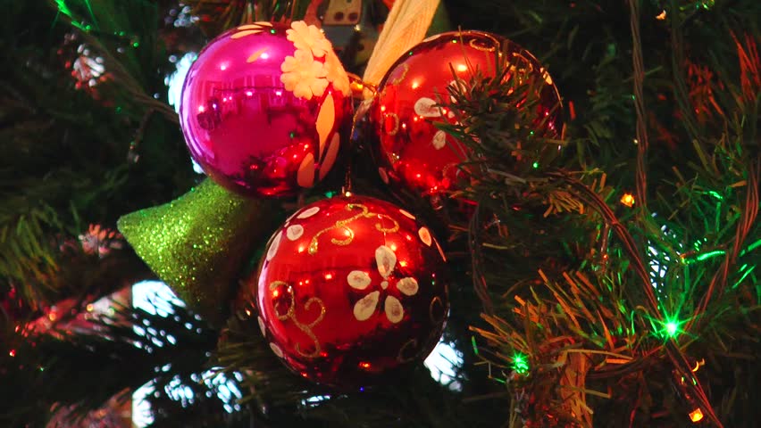 Bright, elegant Christmas tree decorations illuminated by sparkling LED lights.
