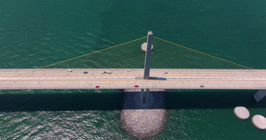 Highway road traffic driving over Sunshine Skyway Bridge in Florida. Transportation infrastructure in USA
