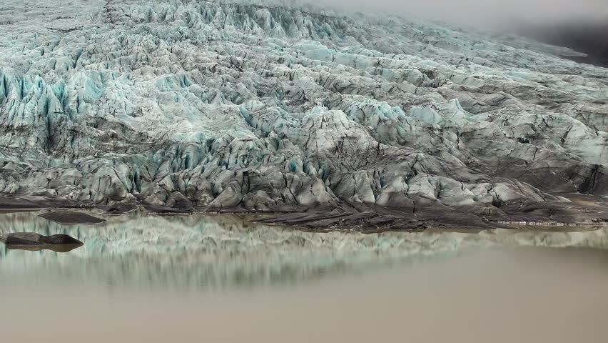 Aerial view of a glacier with glacier lake in Iceland