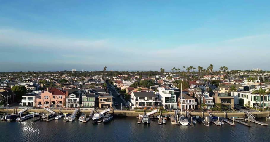 Beautiful aerial drone footage capturing the scenic waterfront homes along Long Beach Harbor, California. Perfect for real estate promotions, travel videos, lifestyle content, and cinematic visuals.