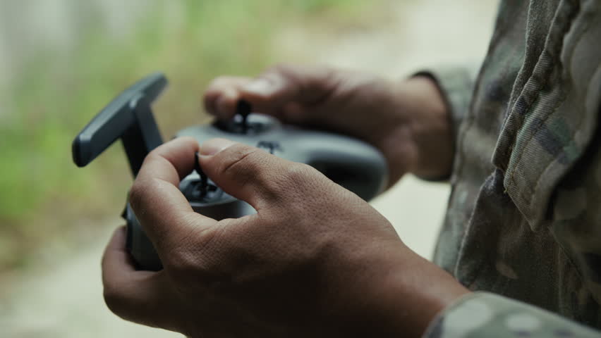 A Soldier Practices Piloting a Military Drone with Radio Control for War