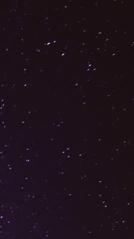 Time‑lapse of the Milky Way and moonrise over a majestic mountain landscape at night, revealing stars, galaxies and shifting light in a tranquil, awe‑inspiring natural scene.