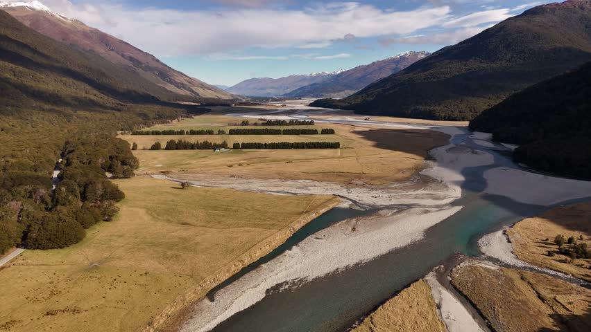 Turquoise River water at mount aspiring national park in New Zealand. Aerial wide shot.