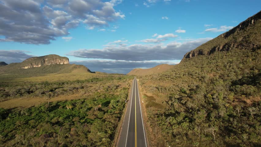 Maytrea Garden, panoramic aerial drone view Jardim de Maytrea, green fields, mountains and Morro da Baleia, Chapada dos Veadeiros, Goiás, Alto Paraíso