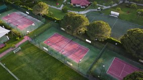 Aerial view of tennis courts and football fields in green field - Powered by Shutterstock - Get 15% off with code: PIKWIZARD15