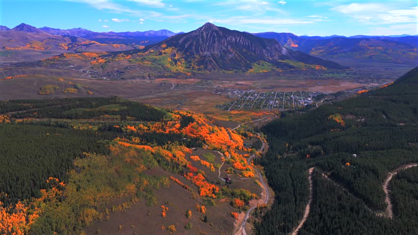 Crested Butte ski resort small Colorado Rocky Mountains down town Main Street drone aerial fall autumn Quaking Aspen Trees leaf peeping season daytime blue skies high clouds Coal Creek Kebler Pass