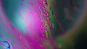 Vertical video. Bubble blur planet. Ink spill. Fantastic neon color fluid mix glowing sphere. Cosmic globe gasoline abstract frame black background. - Powered by Shutterstock - Get 15% off with code: PIKWIZARD15