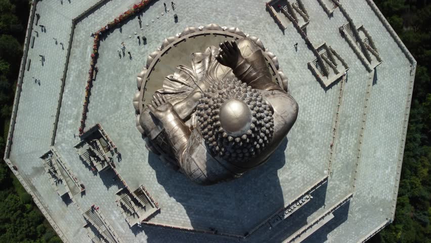 Aerial view of the Golden Buddha statue at Liudingshan Cultural Tourism Area in Dunhua City, Jilin Province, China. Massive golden statue overlooking Zhengjue Temple and facing the Changbai Mountain
