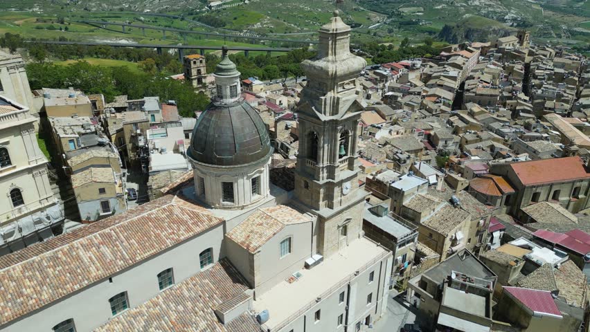 Aerial drone footage of Caltagirone, Sicily: Baroque town with historic buildings, colorful ceramics, and scenic streets. Ideal for travel, culture, and heritage projects.