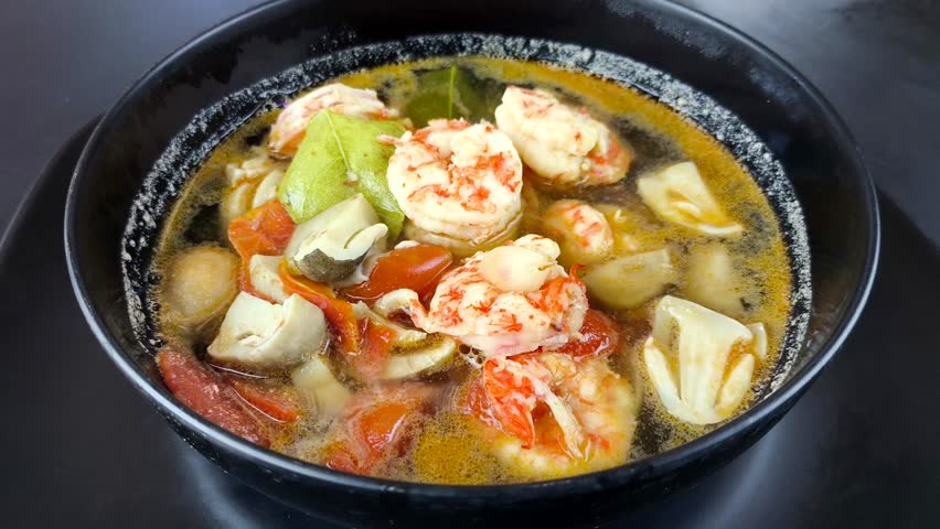 Prawn soup or Tomyam Kung in bowl, Thai famous food.