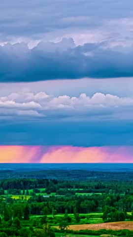 Vivid skies and rolling fields in a vertical timelapse