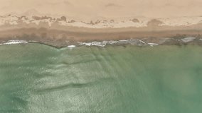 Aerial View of Turquoise Ocean Waves Hitting White Sandy Beach in Vietnam - Powered by Shutterstock - Get 15% off with code: PIKWIZARD15
