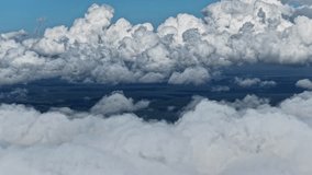 POV soaring close to the peak of a towering storm cloud in bright blue sky - Powered by Shutterstock - Get 15% off with code: PIKWIZARD15