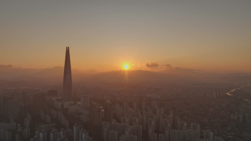 Drone View of Seoul city in South Korea, Sunrise of Jamsil, Songpa, Han River, Summer