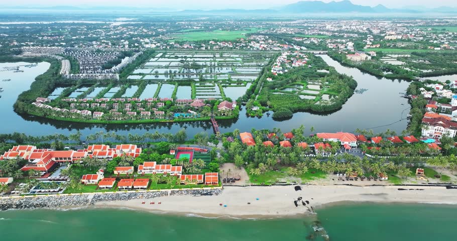 Aerial view of Cua Dai bay in Hoi An ancient town, Vietnam. Agricultural development texture, transport infrastructure and green parks resort