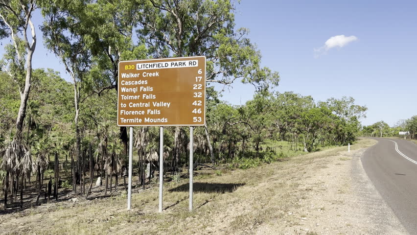 traffic sign pointing wangi falls and other popular travel destinations in the Northern Territory, Australia.