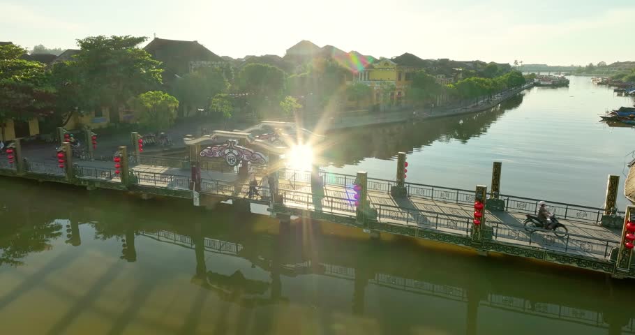 Hoi An, Vietnam - July 7th, 2025: Morning at the wooden bridge in Hoi An ancient town. Famous old town for travel in Vietnam, UNESCO World Heritage.