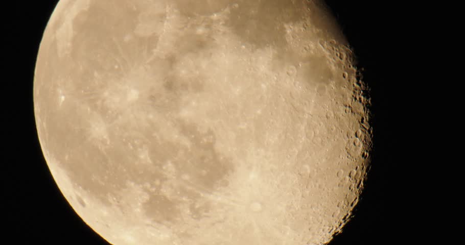 A close-up shot of the moon, showcasing its craters, texture, and detailed surface with incredible clarity against dark sky