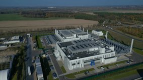 cutting edge technology and futuristic Ai infrastructure of a large-scale data center campus in Germany processing global information. Fantastic aerial view flight static tripod hovering drone - Powered by Shutterstock - Get 15% off with code: PIKWIZARD15