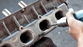 Close-up footage showing valve seat grinding inside an automobile engine using precision tools, representing mechanical engineering, maintenance, and automotive repair process. - Powered by Shutterstock - Get 15% off with code: PIKWIZARD15