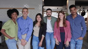 Group of diverse coworkers smiling together at the office. Multiracial team of professionals collaborating and enjoying teamwork. Business and corporate lifestyle concept. - Powered by Shutterstock - Get 15% off with code: PIKWIZARD15