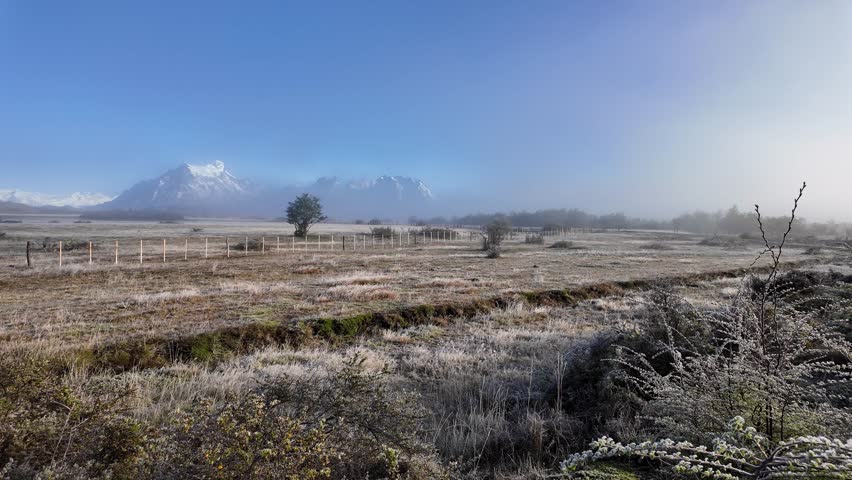 Torres del Paine, Chile: Panoramic footage of plain near Torres del Paine National Park of Patagonia in Chile during snowy sunrise with Cordillera del Paine in the background