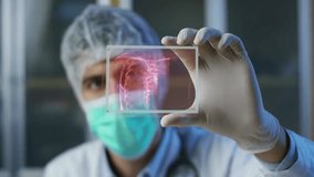 Futuristic doctor draws medicine as a holographic planet appears, symbolizing global healthcare, pharmaceutical innovation, and future medicine. - Powered by Shutterstock - Get 15% off with code: PIKWIZARD15