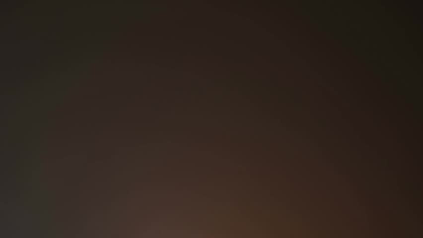 A dramatic time-lapse of a powerful storm flashing lightning across the dark night sky, revealing intense weather patterns and atmospheric energy.