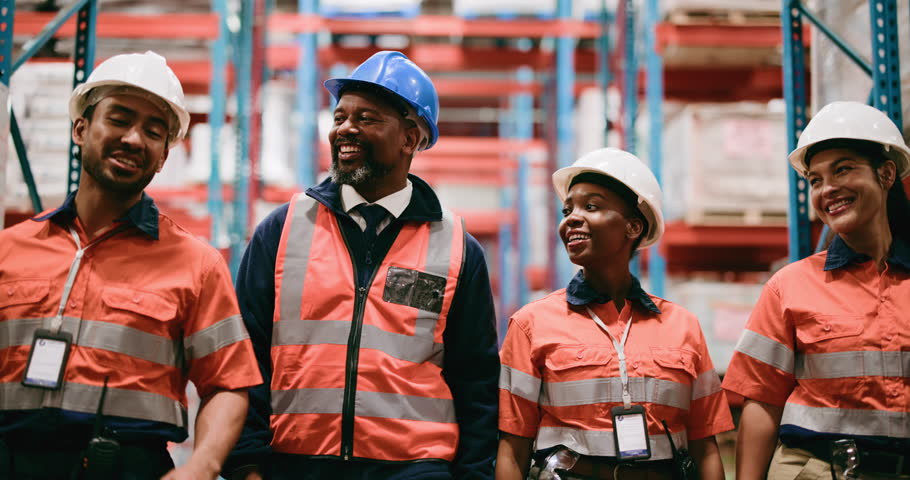 Team, conversation and walking in warehouse for logistics plan, distribution and collaboration. People, smile and discussion in factory with PPE for supply chain update, shipping and export feedback.