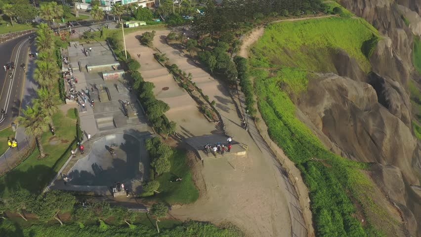 High angle view of people enjoying a sunny day at maria reiche park next to the miraflores cliffs