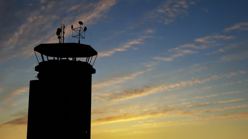 Air Traffic Control Tower at Airport As Airplane Takes Off.