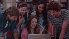 Seated student tapping laptop and group leaning, sparking neon HUD overlaying faces for education. Library, study, collaboration, learners, campus, technology, glow - Powered by Shutterstock - Get 15% off with code: PIKWIZARD15