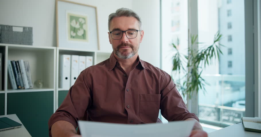 Businessman, face or video call with documents for online meeting or interview in office. Portrait, man or employer with CV, resume or candidate application in POV for virtual discussion in workplace