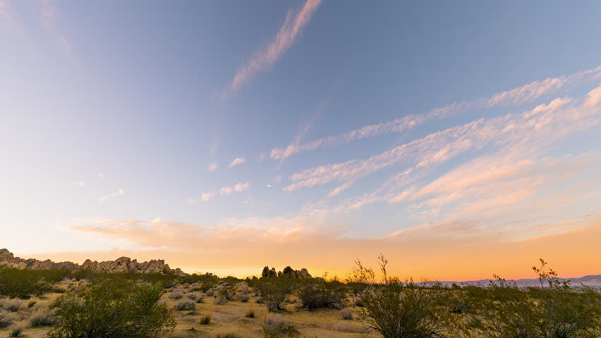 Timelapse of sunset afterglow over desert landscape in Joshua Tree, California, USA
