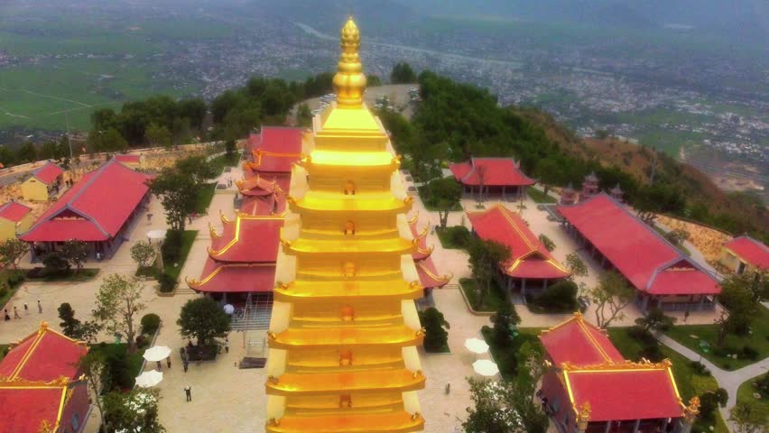 Buddhist temple on the mountain.

Aerial photography by drone. Cloudy weather. The Golden Tower and temple complex on a high mountain near Nha Trang in Vietnam. 