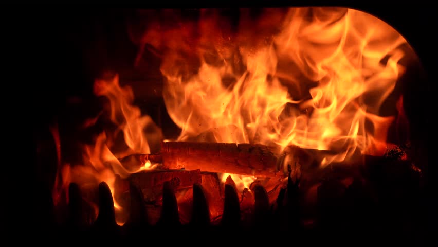 Fireplace fire burning in the dark of night