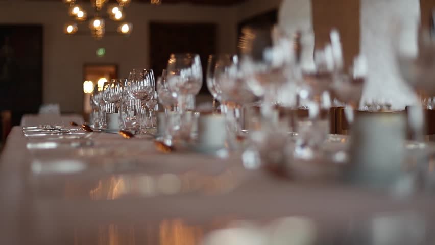 Interior of a medieval castle banquet hall with long wooden tables, chandeliers, stone walls, and warm candlelight. Majestic historical atmosphere of royal feasts, captured in 4K ultra HD. - Powered by Shutterstock - Get 15% off with code: PIKWIZARD15
