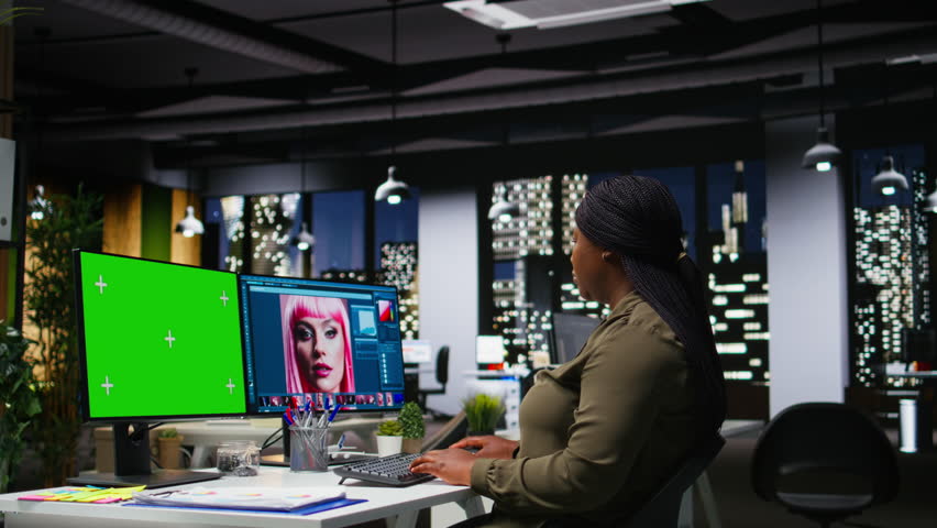 Isolated mockup next to african american editor retouching photo on software, adjusting color grading and lighting for a great effect. Female photographer editing materials for portfolio. Camera A.