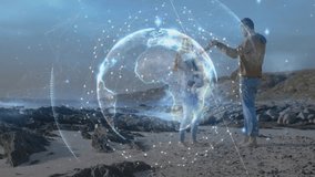 Child taking first steps on shore, parents steadying, tech globe overlaying family pulsing nodes. Hologram, toddler, adults, beach, coast, sand, rocks - Powered by Shutterstock - Get 15% off with code: PIKWIZARD15