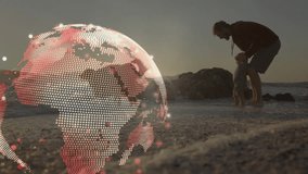 Man lifting baby to surf for bonding while dogs running causing globe overlay showing technology. Beach, sunset, shoreline, waves, sand, horizon, silhouette - Powered by Shutterstock - Get 15% off with code: PIKWIZARD15