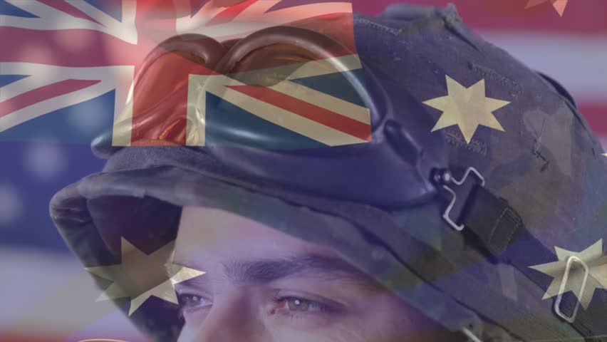 Soldier turning as camera pulling back, flag drifting, stars moving over helmet for military theme. Portrait, patriotic, studio, overlay, camouflage, headshot, stoic